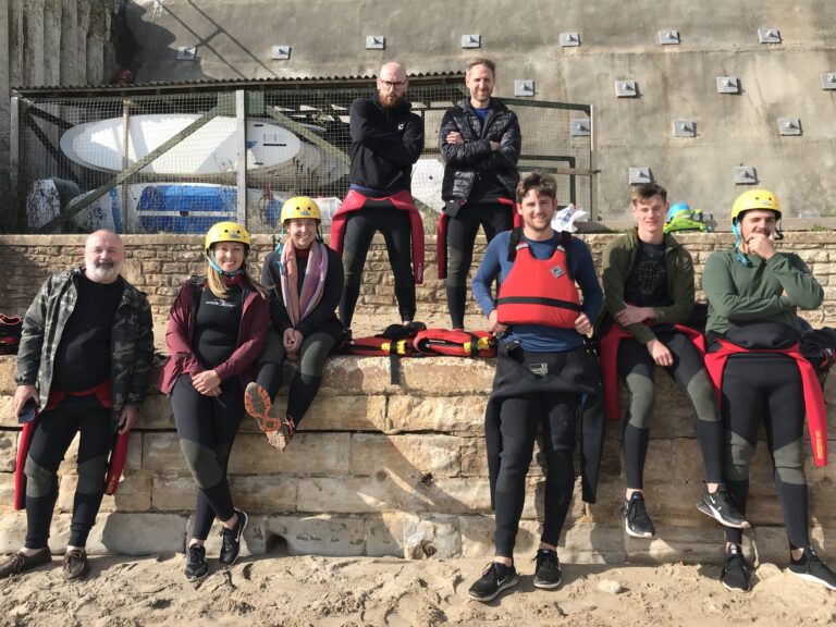 The Canopy Team posing in wetsuits